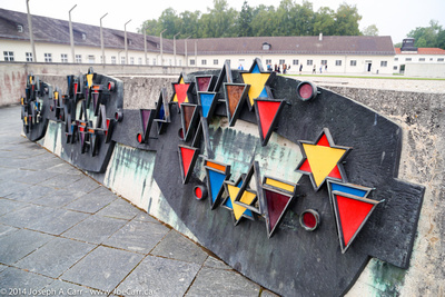 Memorial sculpture showing the colours of badges worn by the prisoners