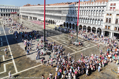 Crowds in St. Mark's Square avoiding the flooding