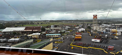 The industrial port area with Hilo airport behind