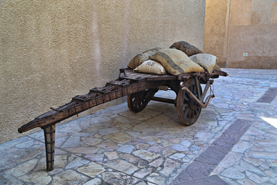 An old cart with sacks of coffee
