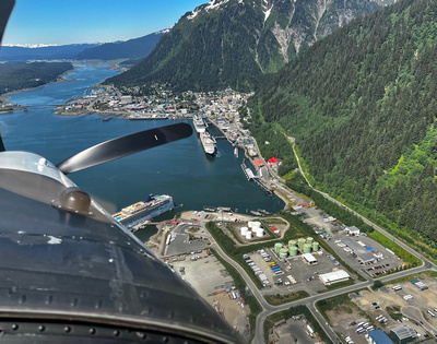 Over flying Juneau with cruise ships and Mt. Roberts