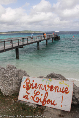 Welcome sign at the end of the wharf - 'Bienvenue à Lifou'