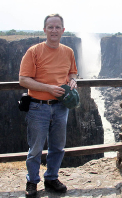 Joe standing beside the Victoria Falls gorge - a hot day!