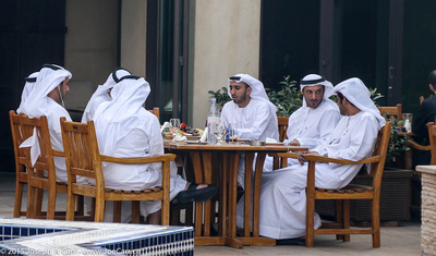 Young Arab men having lunch