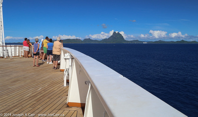 Passengers on the bow as Statendam approaches Bora Bora
