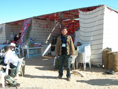 A Libyan man in front of his shop