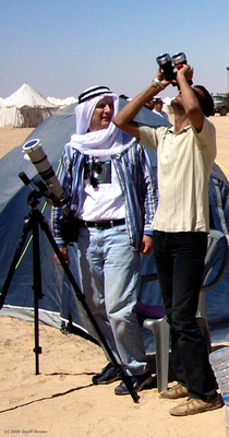 Joe lends his filtered binoculars to a Libyan to observe the Sun