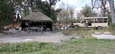 Meal & bar tent, open air fireside lounge and our Land Rover