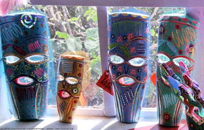 Folk art masks in the window