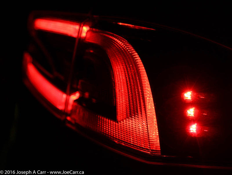 Right rear Tesla running lights at night