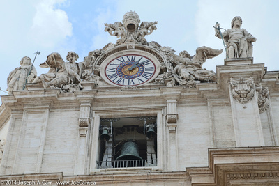 Bell and ornate clock tower on the front of the Basillica
