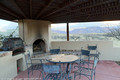 The BBQ patio area beside the pool