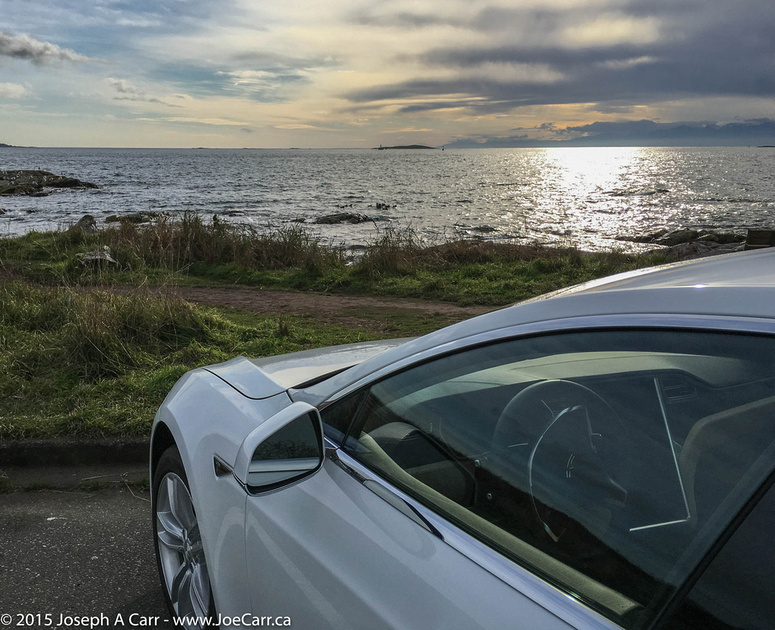 My Tesla Model S by the shoreline at Cattle Point