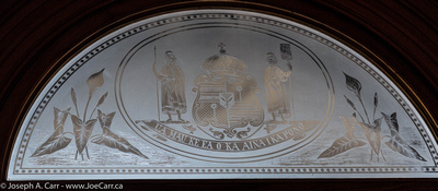 Etched glass panes in the outside doors depicting the Royal Hawaiian crest