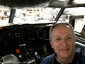 Joe inside a Boeing 720B cockpit simulator