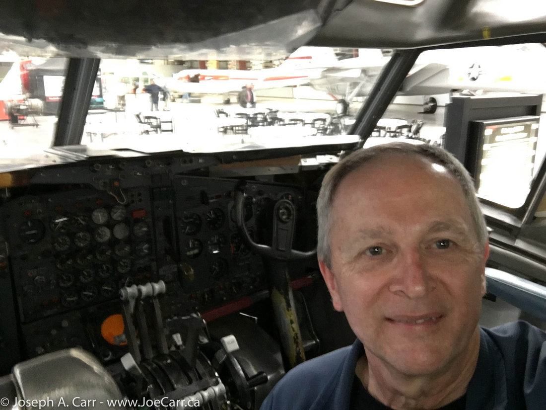 Joe inside a Boeing 720B cockpit simulator