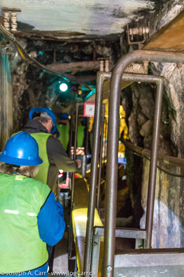 People boarding the passenger train cars before going down the mine