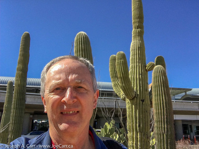 Joe's selfie in front of some Saguero cactus outside the airport entrance