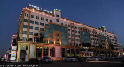 City Seasons Hotel lit at night