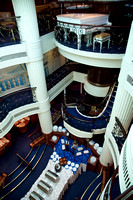 The piano at the top of the multi-level atrium and the restaurant at the bottom