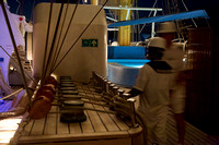 Crew rigging the ship for full sail