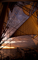 Sunset lighting the Royal Clipper's sails as she leaves the harb