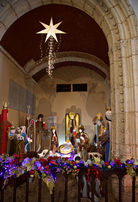 Altar decorated with original Christmas art & manger scene