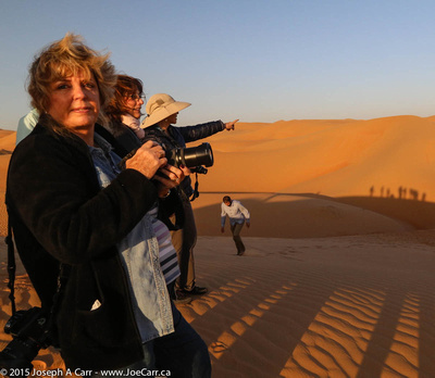 Michele photographing dunes at sunrise
