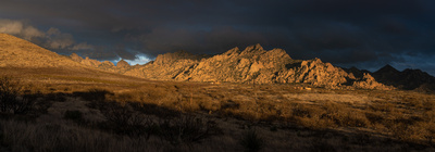 Sunset lighting the Dragoon Mountains with storm clouds