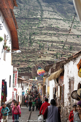 Piscac street with Incan terraced hills behind