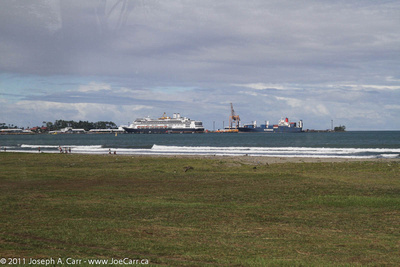 Rotterdam in harbour with Caribbean coastal beach