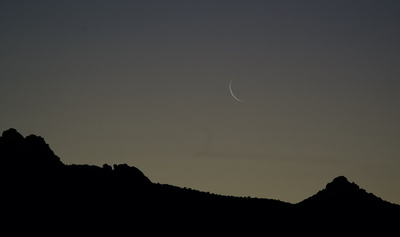 Very thin waning crescent Moon over the Dragoon Mountains in the pre-dawn
