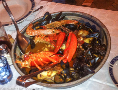 Seafood stew cooked in an amphora