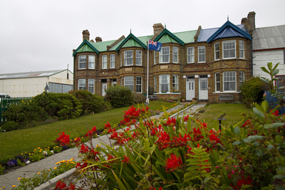 The Falkland's flag flying in front of the heritage Jubilee Villas