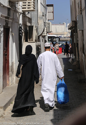 An Omani couple with their shopping from the souq