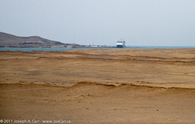 Rotterdam in the distance across the Paracas Bay sand dunes