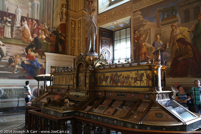Frescos and ornate ancient bookcase