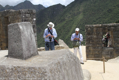 John McDonald and Grimaldo verify the North direction on the Incan sundial Intihuatana stone