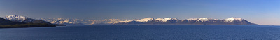Northern snow capped mountains as we sail away from Whittier
