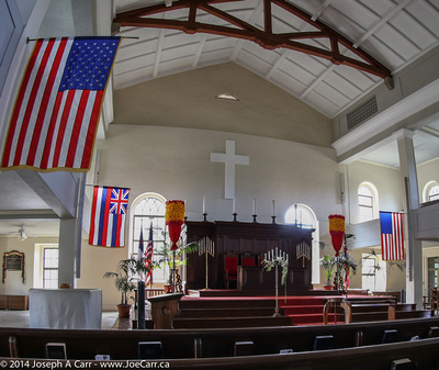 Alter and flags inside the church sanctuary