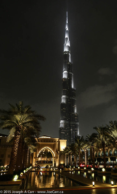 Burj Khalifa tower & the Palace Hotel pools courtyard lit up at night