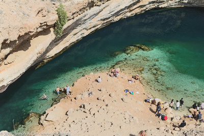 Swimmers in the Bimmah Sinkhole