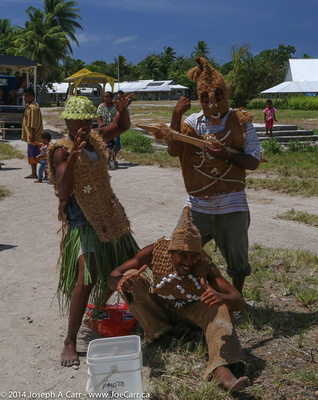 Islander men in traditional warrier armour made from coconut husk and shells