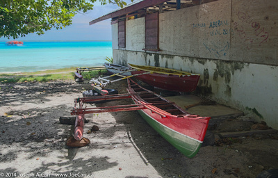 Outrigger canoes with the lagoon behind
