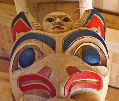 Top two figures on a totem in the Clan House