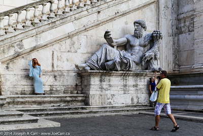 Fashion shoot beside a statue of Zeus/Poseidon