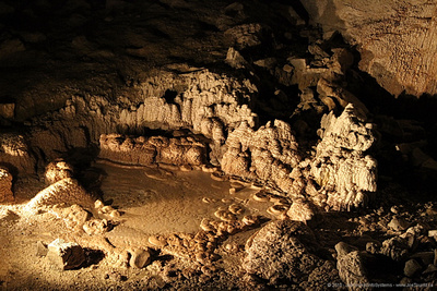 Brown and white cave formations in gallery