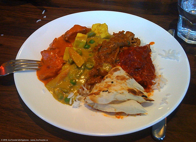 Butter Chicken,  Aloo Matar (potatoes & peas in gravy), Lamb Korma, rice and Nan bread