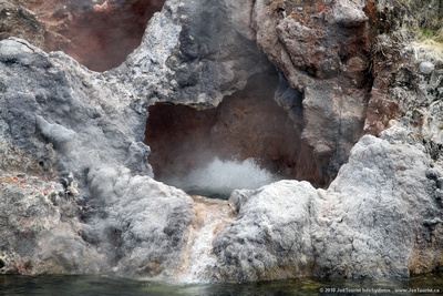 Small geyser erupting on the Steaming Donne Cliffs