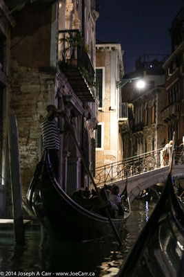 Gondolas on a canal at night